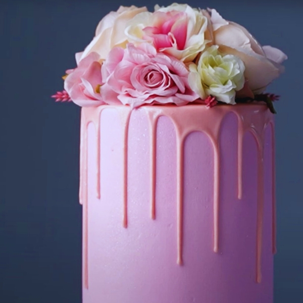 pink drip cake with flowers